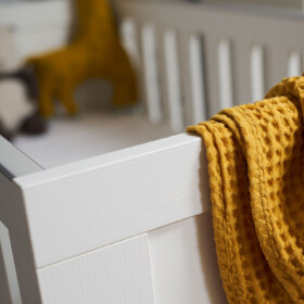 Creative photo showing cot and blanket
